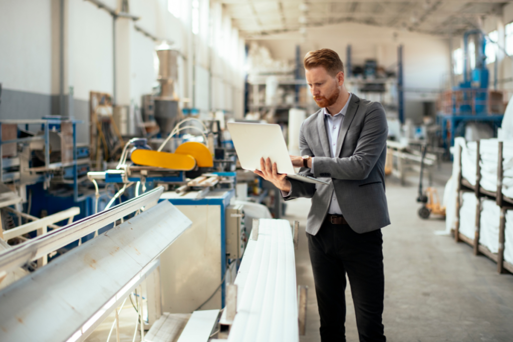 Production floor manager in manufacturing plant using cloud connectivity on computer to successfully review production schedules