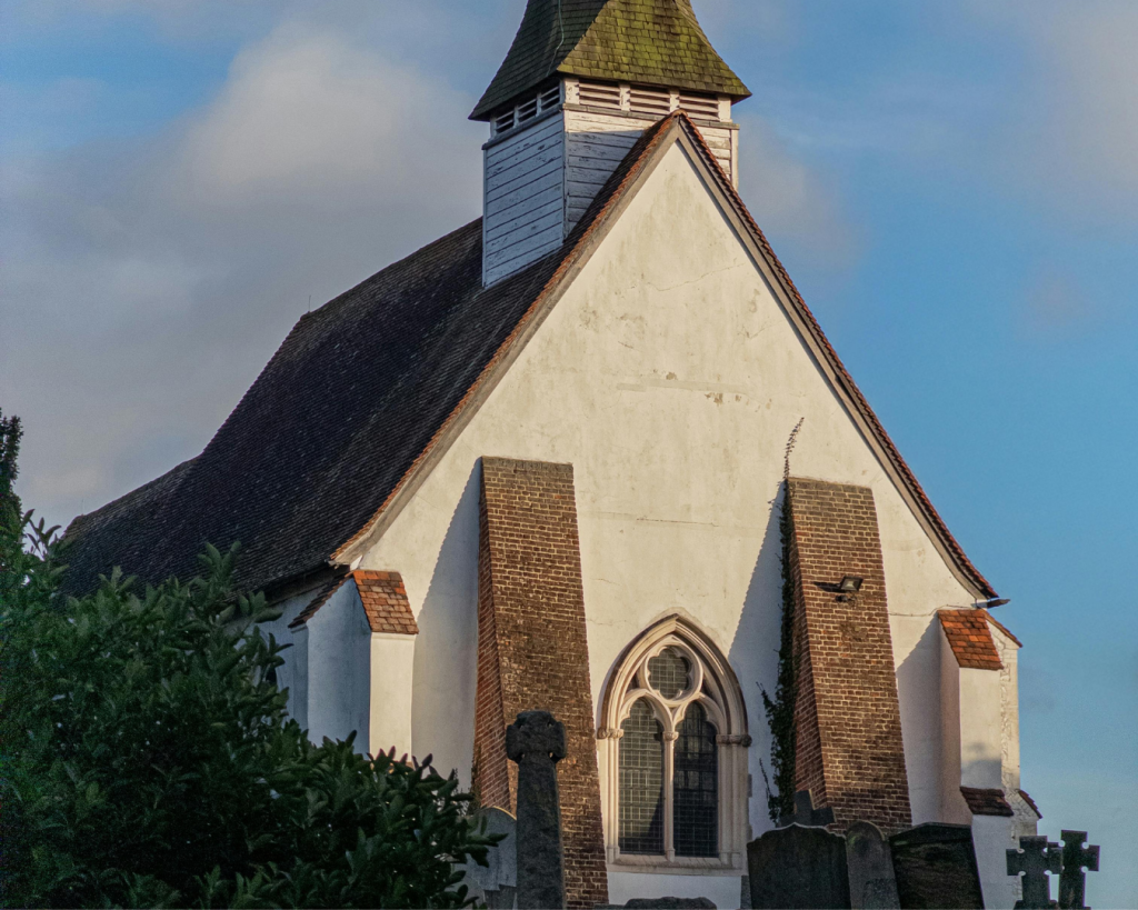IT Services & Support for Churches 6 Traditional church building exterior with steeple, representing faith-based organizations supported by reliable church IT services